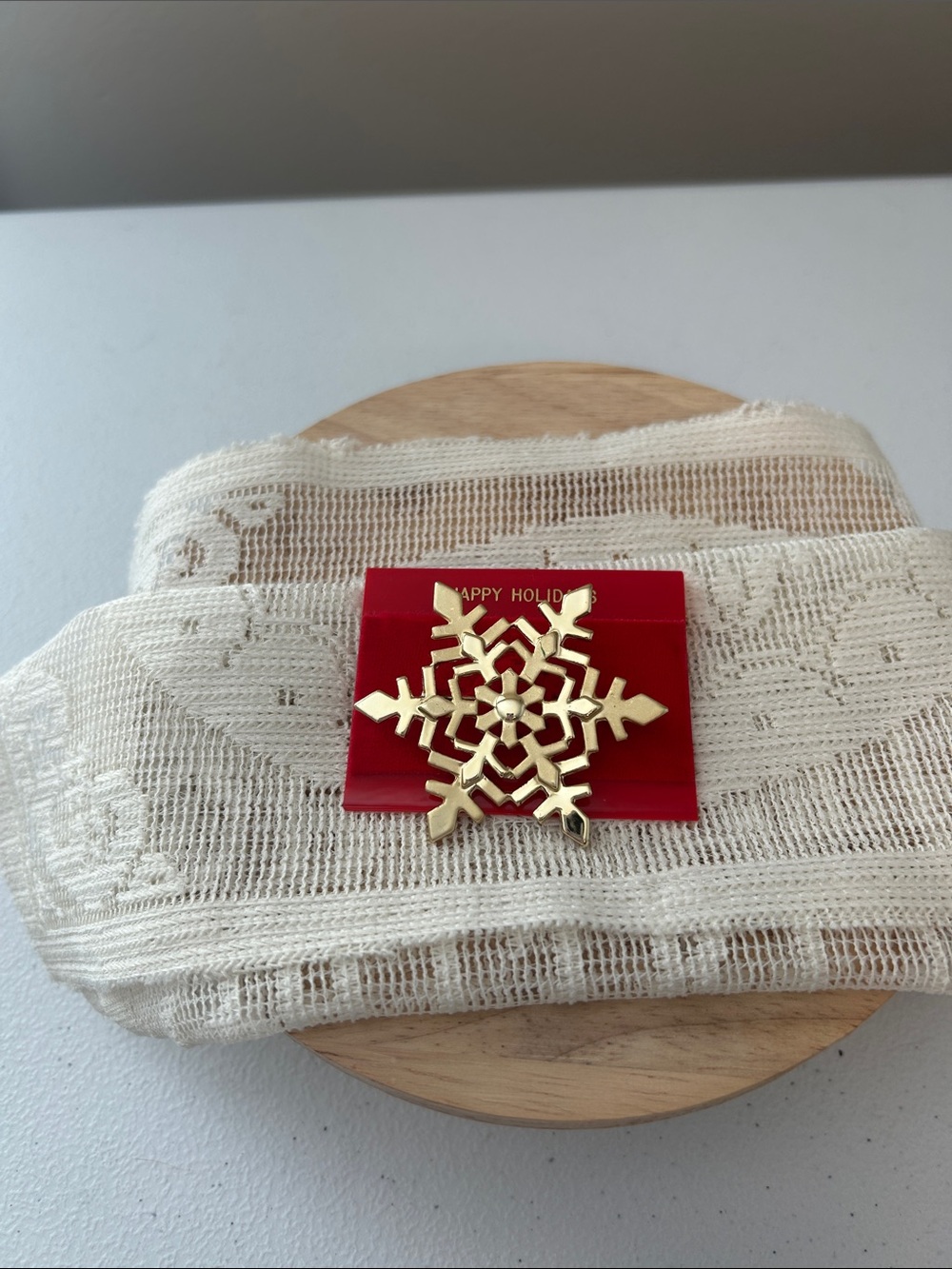 Vintage gold-tone metal snowflake brooch